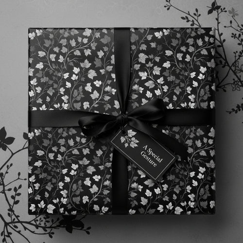 Elegant floral wrapping paper in monochrome with black ribbon and a "Special Gesture" tag.