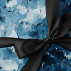 Textured blue and white gift wrap with a tied black ribbon.