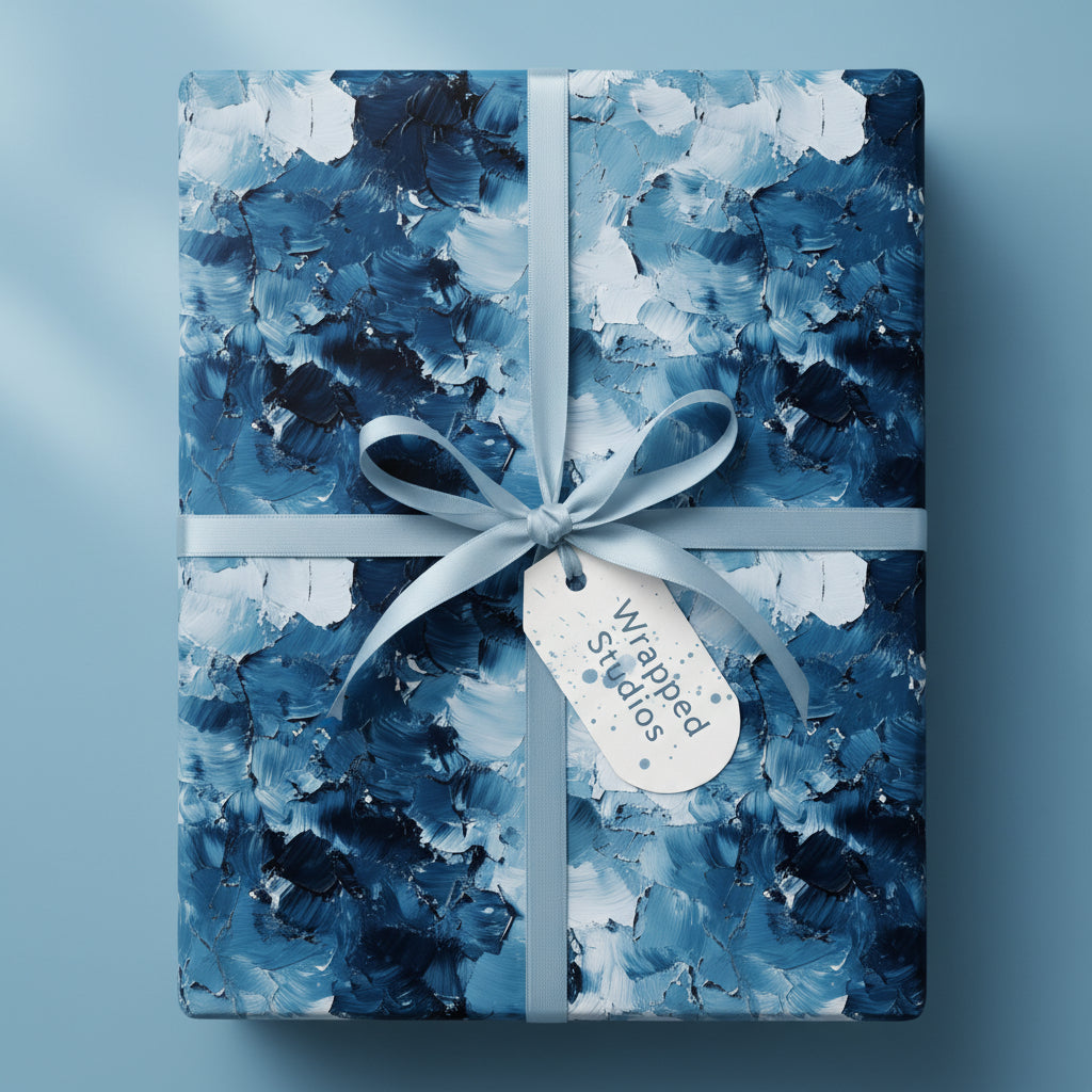 Abstract blue and white luxury gift wrap with ribbon and tag on a square gift box.