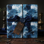 Elegant gift wrapped in blue abstract art wrapping paper with navy velvet ribbon and handcrafted tag.