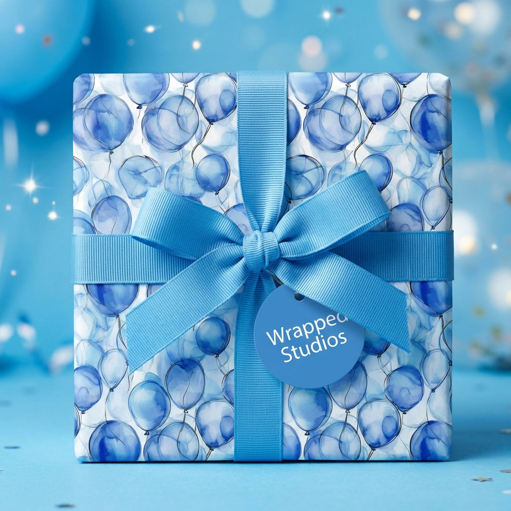 Wrapped Studios blue balloon wrapping paper with matching ribbon, perfect for a boy's birthday gift.