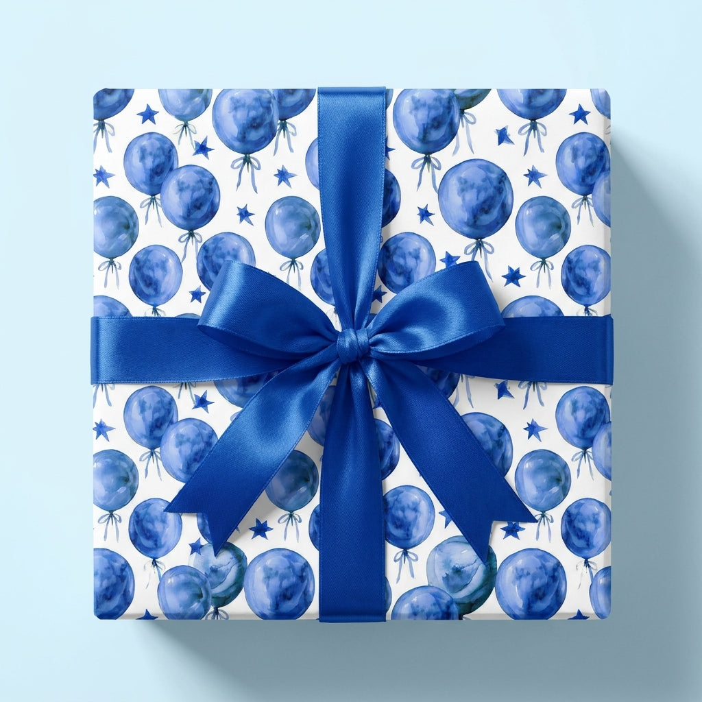 Blue watercolor balloon wrapping paper with a satin ribbon bow for birthdays, by Wrapped Studios.