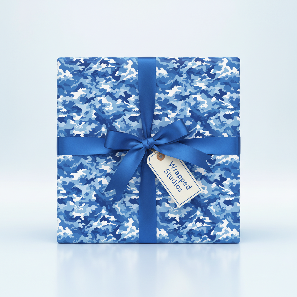 Square gift wrapped in blue camo wrapping paper with satin ribbon and tag.