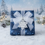 Blue floral wrapping paper with silver ribbon and "Warmest Wishes" tag, perfect Christmas gift wrap.