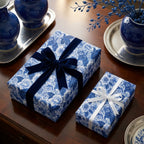 Elegant blue and white chinoiserie floral wrapping paper with a velvet ribbon by Wrapped Studios.