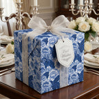 Blue floral wrapping paper with white organza bow on a luxury wedding gift box by Wrapped Studios.