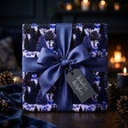 Luxury blue Christmas wrapping paper with winter trees, navy ribbon, and tag by Wrapped Studios.