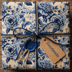 Blue floral wrapping paper with twine, handmade tag, and wax seal.