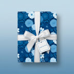 Elegant floral wrapping paper in shades of blue with a white ribbon, bow, and "Just For You" gift tag.