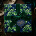 Green floral wrapping paper with elegant velvet ribbon and tag by Wrapped Studios.
