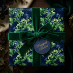 Green floral wrapping paper with elegant velvet ribbon and tag by Wrapped Studios.