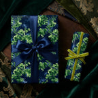 Luxury botanical floral wrapping paper with elegant ribbons by Wrapped Studios.