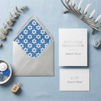 Hanukkah invitation with Star of David pattern envelope liner and RSVP card by Wrapped Studios.