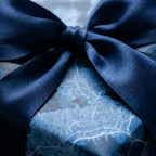 Blue city map wrapping paper with a luxury navy satin ribbon, elegant gift wrap by Wrapped Studios.