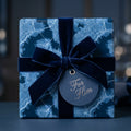 Luxury blue map wrapping paper for him with a navy velvet bow by Wrapped Studios.