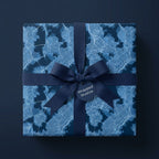 Luxury blue city map wrapping paper with a navy grosgrain ribbon bow by Wrapped Studios.
