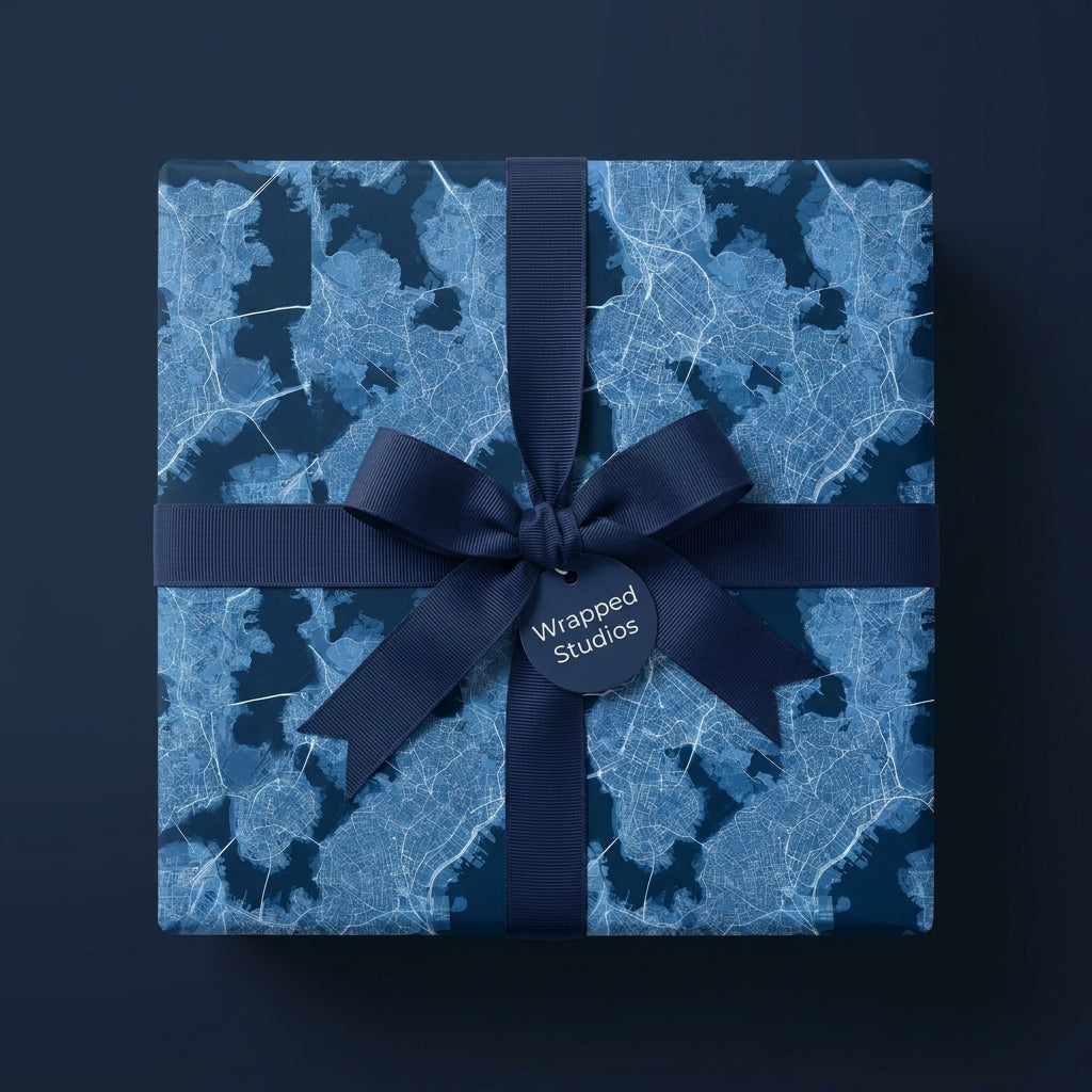 Luxury blue city map wrapping paper with a navy grosgrain ribbon bow by Wrapped Studios.