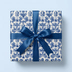Chinoiserie blue nutcracker Christmas wrapping paper with satin bow, Wrapped Studios.