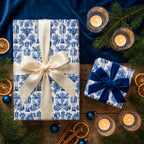 Luxury blue and white nutcracker Christmas wrapping paper on holiday gifts with bows by Wrapped Studios.