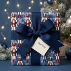 Luxury nutcracker Christmas wrapping paper in navy blue with ribbon bow and gift tag by Wrapped Studios.