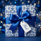 Luxury blue nutcracker Christmas wrapping paper with satin bow and Noel tag by Wrapped Studios.