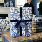 Blue and white chinoiserie nutcracker Christmas gift wrap with velvet ribbon by Wrapped Studios.