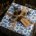 Blue nutcracker Christmas wrapping paper with rustic twine and cheers tag by Wrapped Studios.