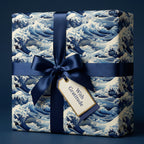 Sophisticated navy wave wrapping paper with a satin ribbon and "With Gratitude" tag for elegant gift-giving.