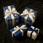 Wrapped presents in elegant blue owl pattern wrapping paper with satin ribbons.