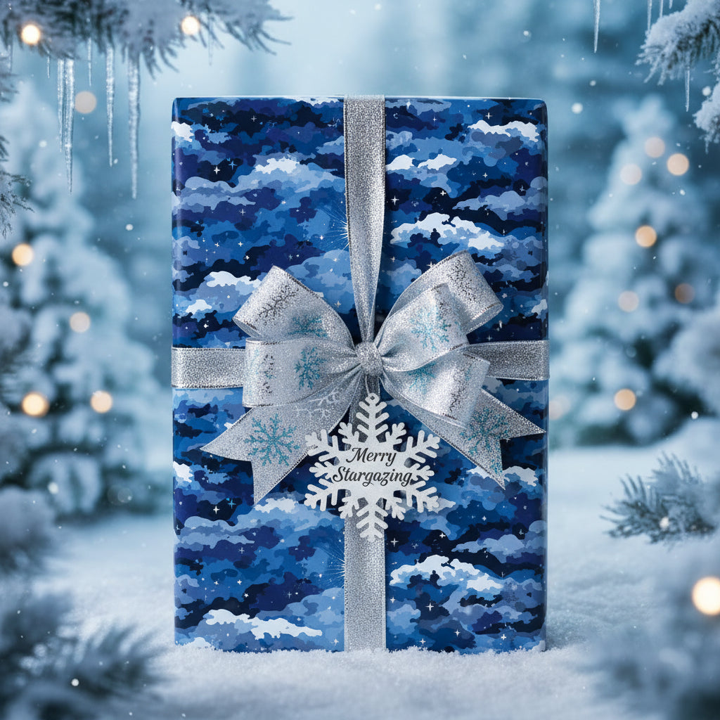 Elegant Christmas gift wrap with a blue sky pattern, silver ribbon, and snowflake ornament.