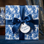 Luxury blue and white toile wrapping paper with a navy satin bow by Wrapped Studios.