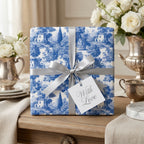 Vintage blue toile wrapping paper with a silver ribbon bow and "With Love" tag by Wrapped Studios.