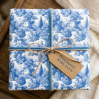 Blue toile wrapping paper with velvet ribbon and a handmade gift tag by Wrapped Studios.