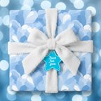 Blue floral wrapping paper on a square gift box with a fluffy white bow and a "Just for you" star tag.