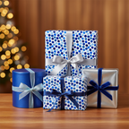 Christmas gifts wrapped in blue-toned polka dot paper and silver gift wrap with velvet ribbon.