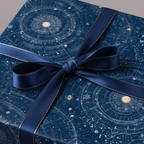 Navy gift box in astrology wrapping paper with blue ribbon & gold trim.