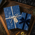 Blue science wrapping paper with chemistry flasks on gift boxes by Wrapped Studios.
