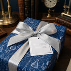 Navy blue science wrapping paper with chemistry flask designs and a silver bow by Wrapped Studios.