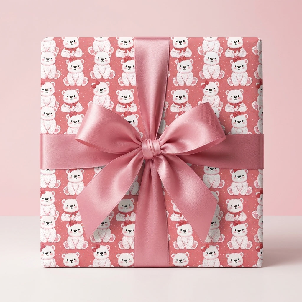 Pink teddy bear wrapping paper with a matching satin bow, perfect for baby showers by Wrapped Studios.