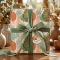 Boho botanical wrapping paper with a sage green velvet ribbon by Wrapped Studios.