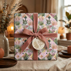 Luxury floral wrapping paper with dusty pink velvet ribbon on a gift box by Wrapped Studios.