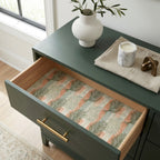 Sage green botanical wrapping paper used as a decorative drawer liner by Wrapped Studios.