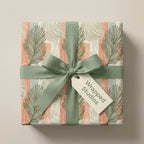 Boho botanical wrapping paper with sage green palm leaves, terracotta stripes, and ribbon by Wrapped Studios.