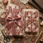 Luxury dusty rose floral wrapping paper with vintage roses and satin ribbons by Wrapped Studios.