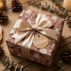 Vintage floral wrapping paper on a rustic gift box with a champagne satin bow by Wrapped Studios.