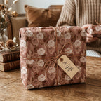 Dusty rose vintage floral wrapping paper with twine string and a gift tag, by Wrapped Studios.