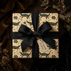 Alligator wrapping paper with a black fabric bow on a luxury gift box by Wrapped Studios.