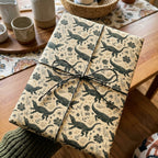 Rustic alligator wrapping paper on a kraft gift box with twine by Wrapped Studios.