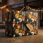 Christmas gift wrap featuring Black women with afros, on a box with a Celebrate tag by Wrapped Studios.