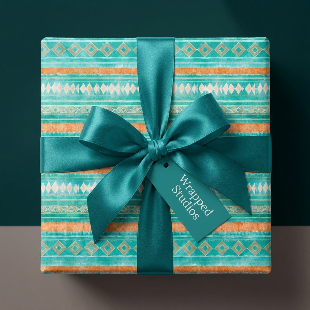 Boho southwest wrapping paper in teal and orange with a satin bow by Wrapped Studios.